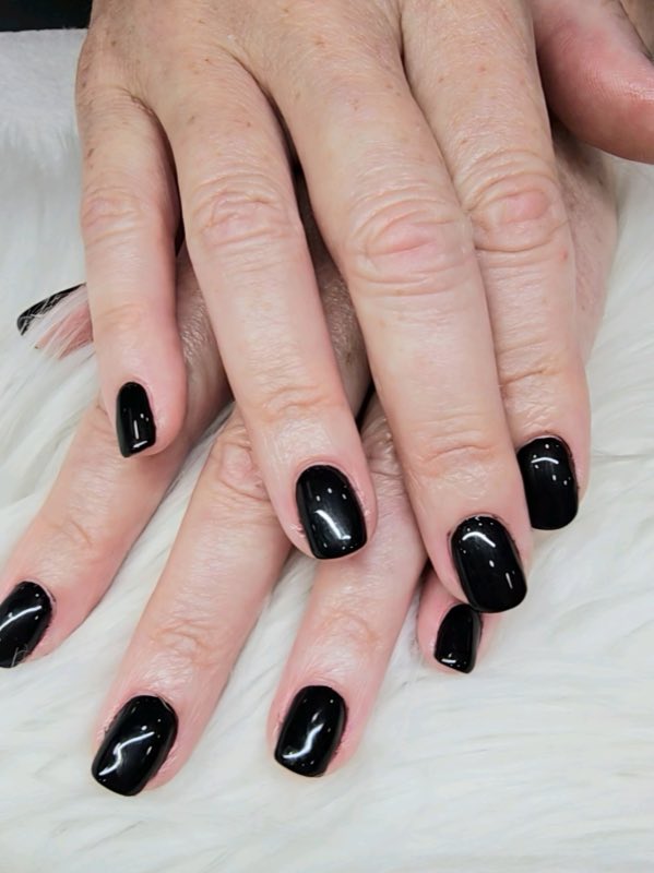 Glossy black gel manicure at Beauty Energy Salon & Spa