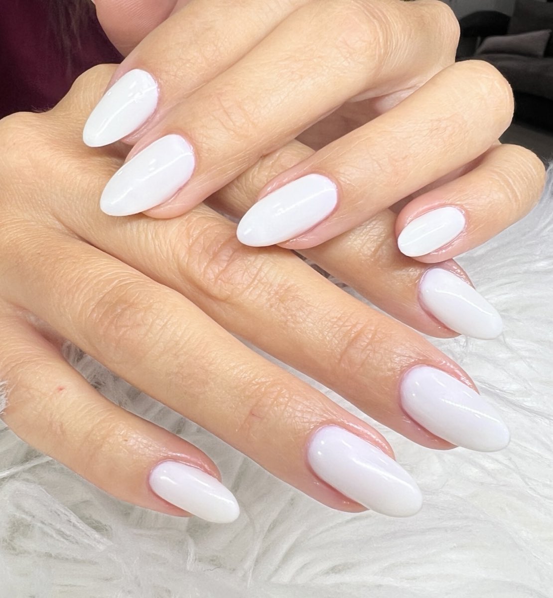 Glossy white almond gel manicure by Beauty Energy Salon & Spa